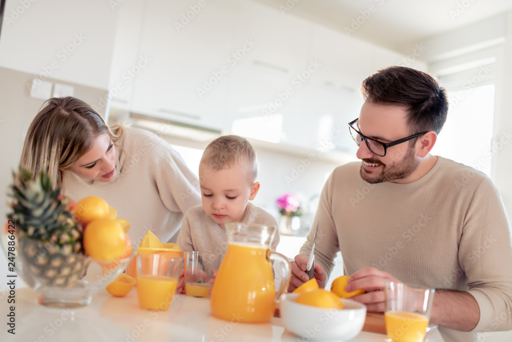 Family make fresh orange juice Family make fresh orange juice