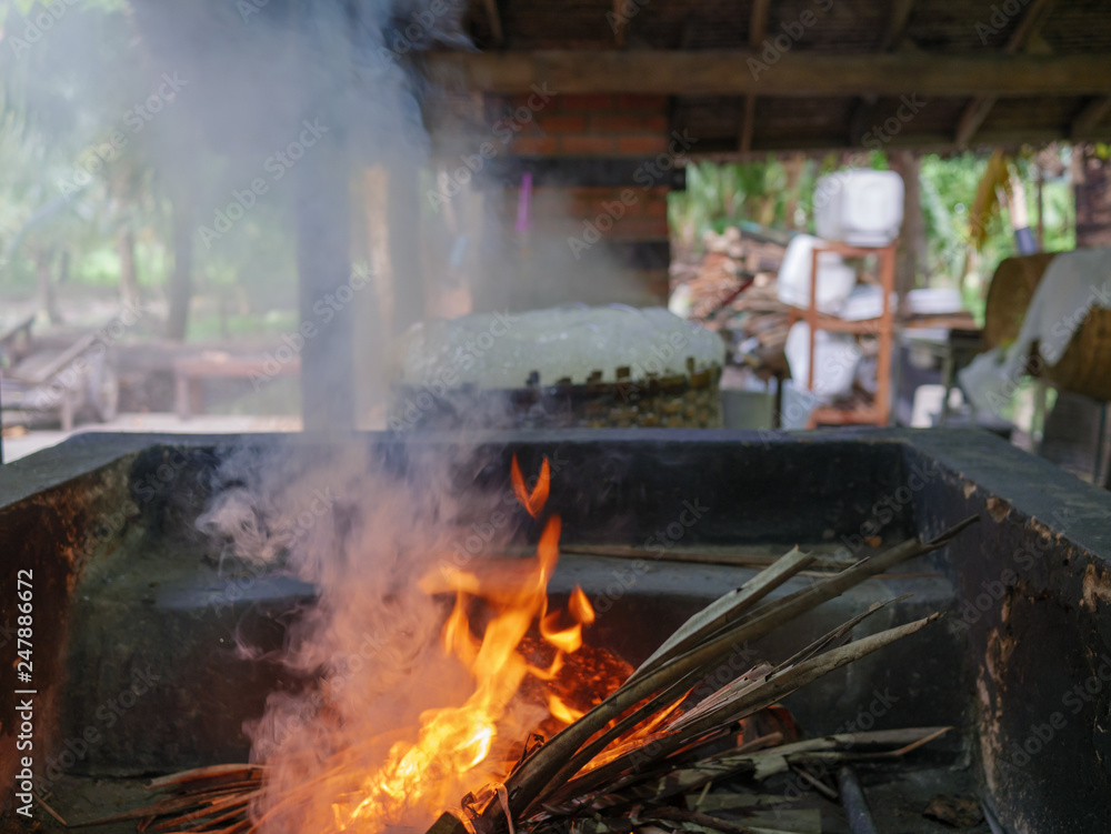 burning firewood in the fireplace. fire logs lit fires in the foreground burning firewood in the fireplace. fire logs lit fires in the foreground