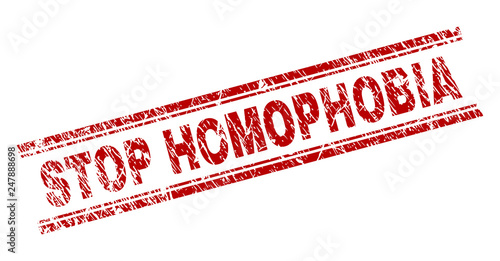 STOP HOMOPHOBIA seal print with grunge texture. Red vector rubber print of STOP HOMOPHOBIA tag with grunge texture. Text tag is placed between double parallel lines.