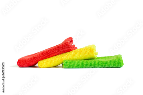 Colorful microfiber towels lying on top of each other . Isolated on white background. Copy space.
