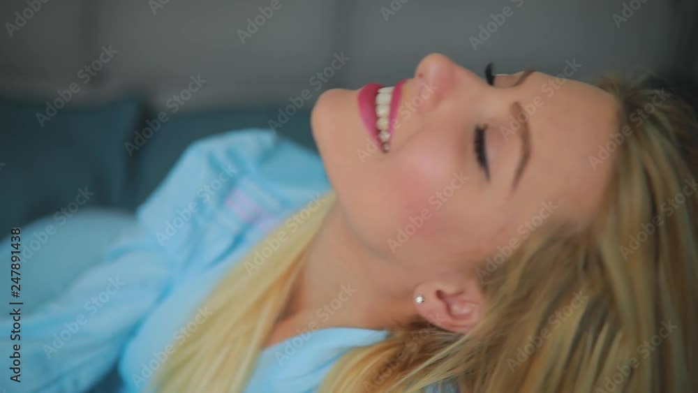 Sexy smiling woman plays with her beautiful hair, slowmotion Sexy smiling woman plays with her beautiful hair, slowmotion