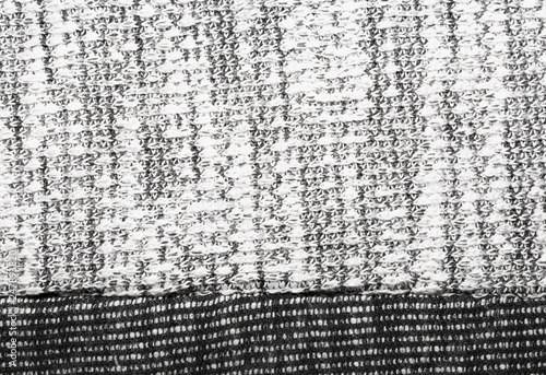 The texture of the knitted gray fabric for the background 