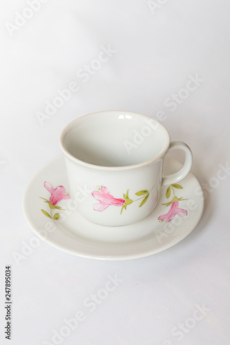 a white tea set with pattern on white background