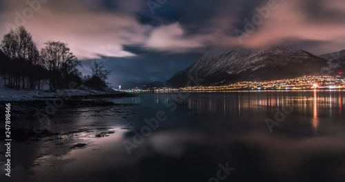 Motion timelapse of Ørsta with fast clouds and iced salt water. Long exposure photos. In Sunnmøre in Møre og Romsdal photo