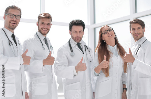group of doctors showing thumbs up