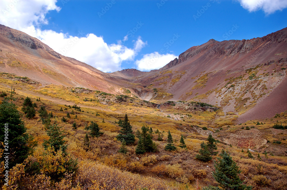 Fall foliage coat soaring mountains along the Rico Silverton trail in the San Juan range of the Colorado Rockies. Fall foliage coat soaring mountains along the Rico Silverton trail in the San Juan range of the Colorado Rockies.