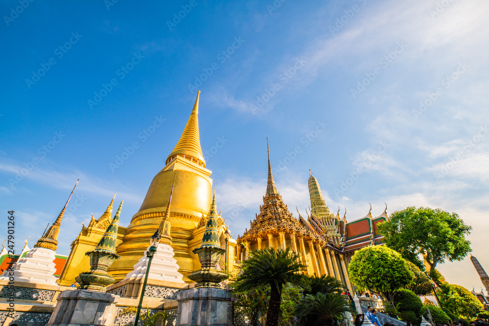 Temple of the emerald buddha golden pagoda with blue sky cloud
