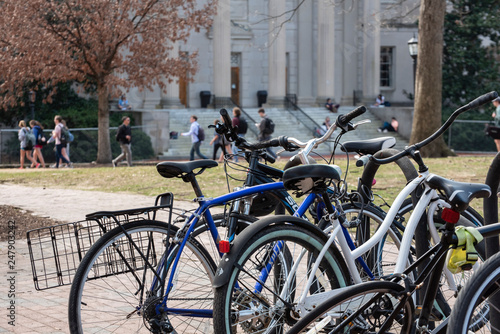 A bike rack on a college campus in the Spring