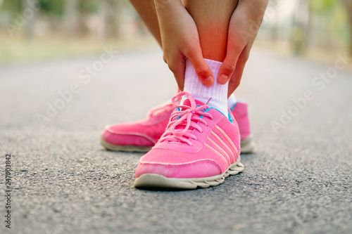 close up runer woman with leg injury and pain photo