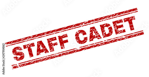 STAFF CADET seal print with corroded style. Red vector rubber print of STAFF CADET label with corroded texture. Text tag is placed between double parallel lines.