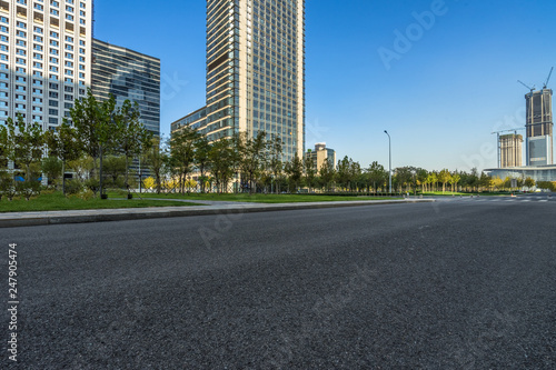 cityscape and skyline of shanghai from empty asphalt road.