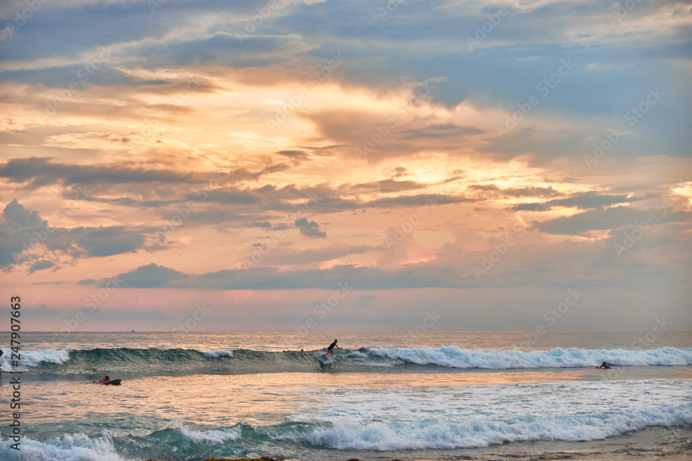 Stunning sunset on the beach overlooking the ocean and the waves. Stunning sunset on the beach overlooking the ocean and the waves.