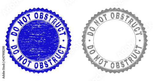 Grunge DO NOT OBSTRUCT stamp seals isolated on a white background. Rosette seals with grunge texture in blue and gray colors. Vector rubber stamp imprint of DO NOT OBSTRUCT tag inside round rosette.