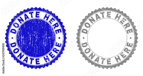 Grunge DONATE HERE stamp seals isolated on a white background. Rosette seals with grunge texture in blue and grey colors. Vector rubber stamp imprint of DONATE HERE caption inside round rosette.