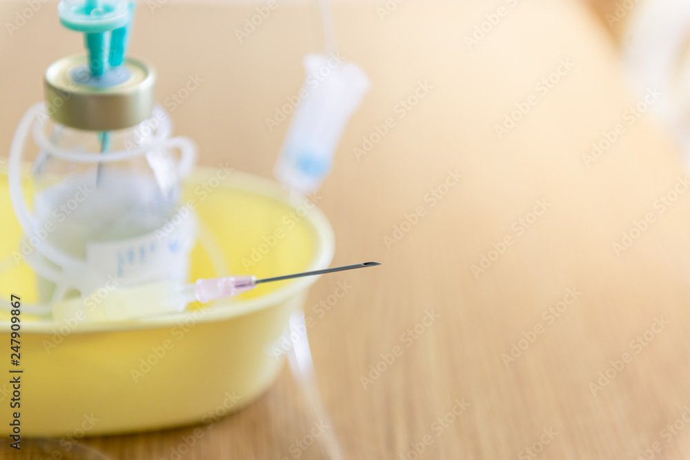 Syringe and brine, Saline solution for patient in hospital, Intravenous medication. Syringe and brine, Saline solution for patient in hospital, Intravenous medication.
