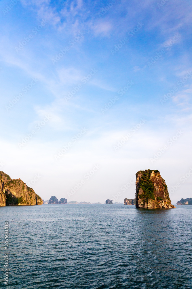 Halong bay vertical panorama at unset, UNESCO world natural heritage, Vietnam.