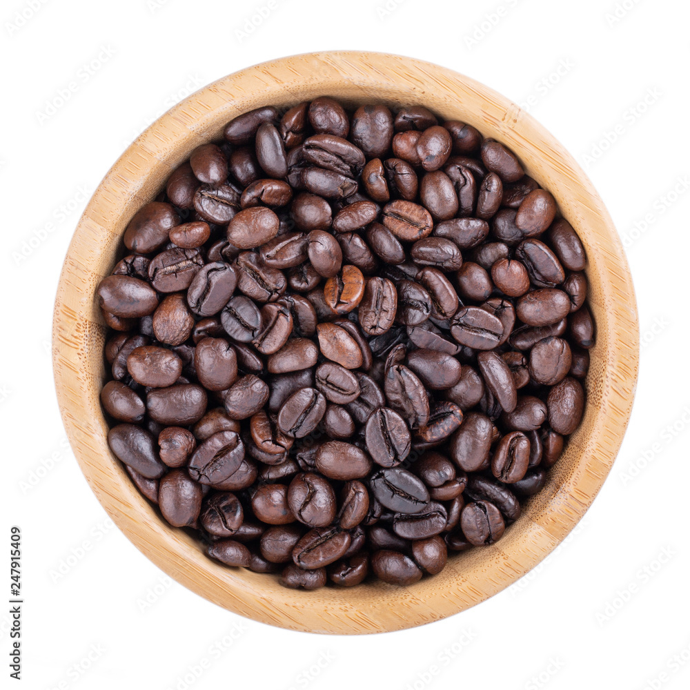 Coffee beans in wooden bowl isolated on white. Elephant dung coffee. Top view. Coffee beans in wooden bowl isolated on white. Elephant dung coffee. Top view.
