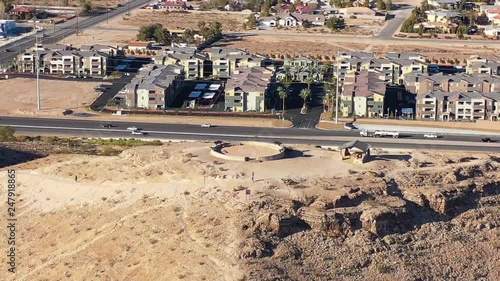 drone circling hill in town photo