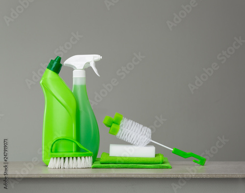 Fotografie Green set of cleaning products and tools for spring cleaning.