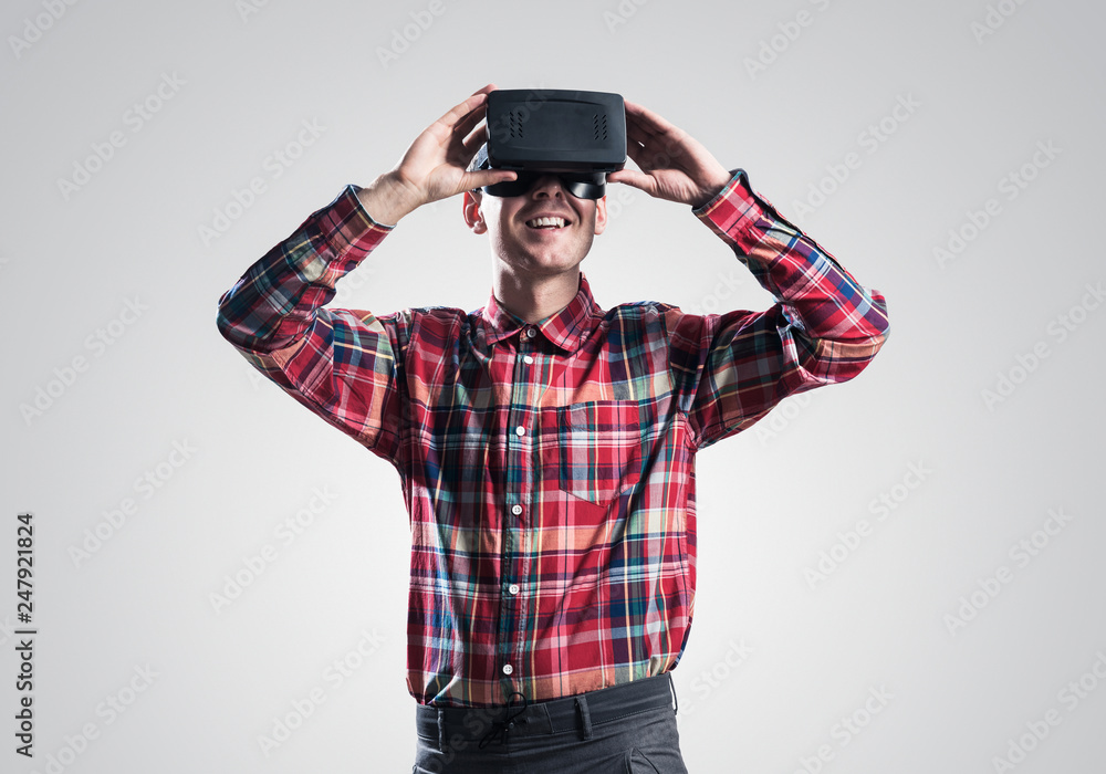 Guy in mask experiencing virtual reality as new entertainment device Guy in mask experiencing virtual reality as new entertainment device