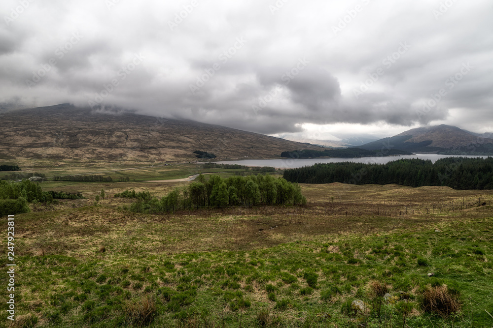 Fototapeta premium Dark clouds and countryside, Scotland