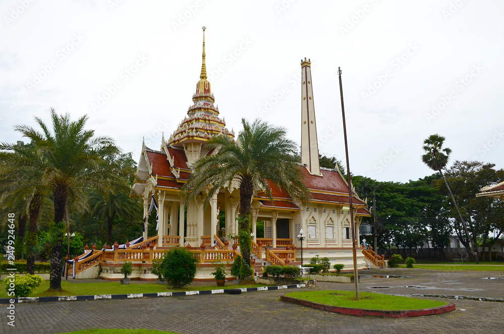 Wat Chalong Temple, Phuket, Thailand. View on building of the temple surrounded by palms