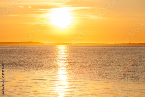 Quiet beautiful golden sunset on the sea. Summer nature background © Victoria