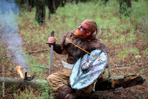 Bloody real viking with a arrow on his shield
