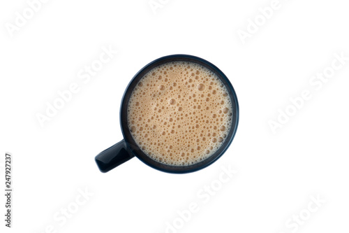 White coffee with milk in a mug view from top isolated over white background