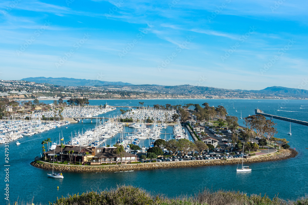 View on Dana Point Harbor with mountains and sky on the background