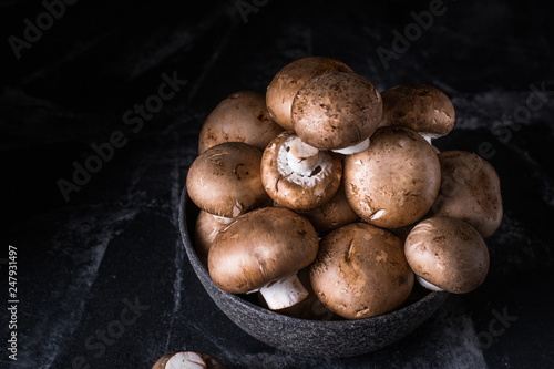 Harvest of mushrooms in plate. Selective focus. Royal champignon. Vegan. Vegetarian food, Vitamin. Healthy food. Process of cooking.