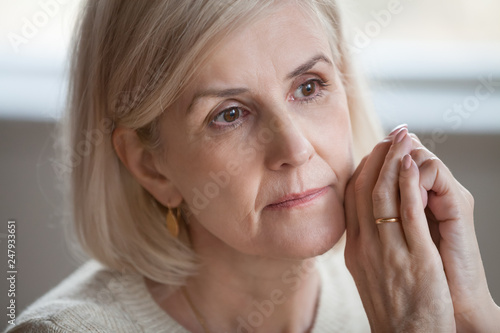 Fotografie Close up portrait sad thoughtful attractive old woman