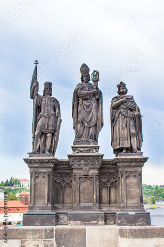 Statues on the Charles Bridge in Prague. Architecture of Prague old town © ppvector