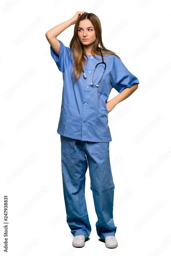 Full body Young nurse having doubts while scratching head on isolated background Full body Young nurse having doubts while scratching head on isolated background
