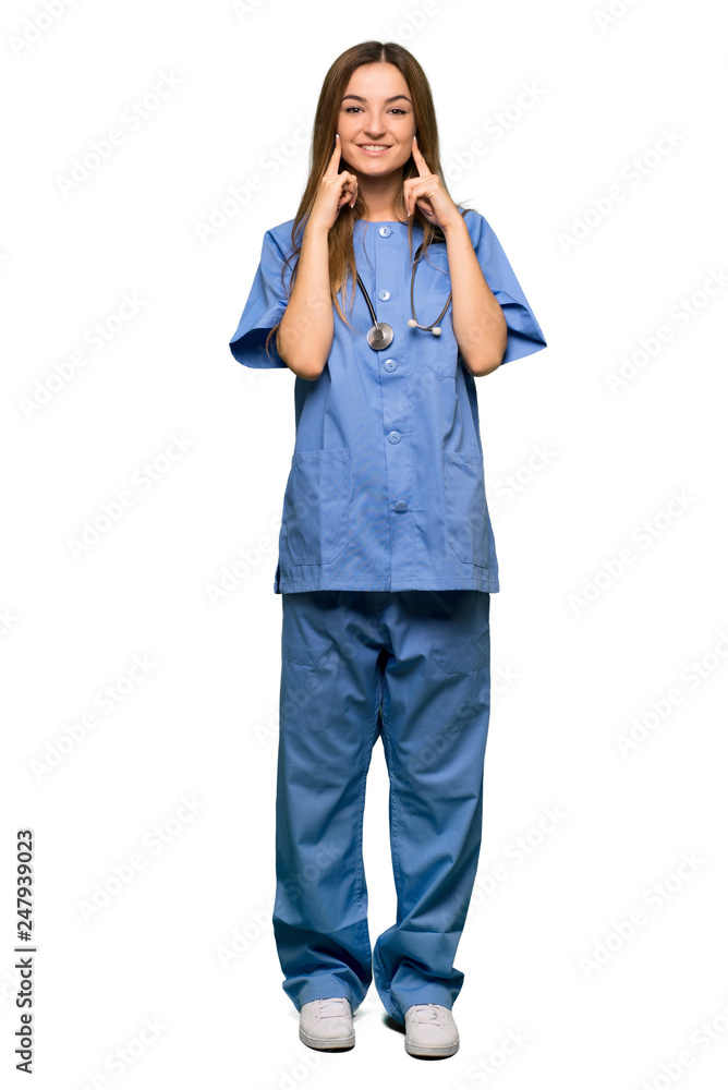 Full body Young nurse smiling with a happy and pleasant expression on isolated background Full body Young nurse smiling with a happy and pleasant expression on isolated background
