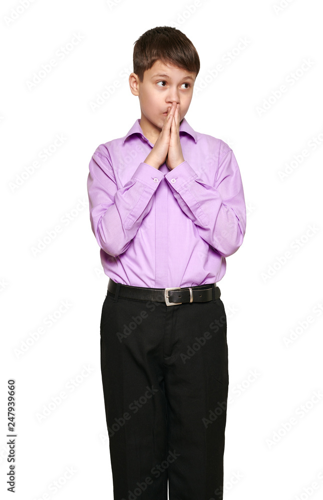 Boy posing on white background, black trousers and purple shirt Boy posing on white background, black trousers and purple shirt