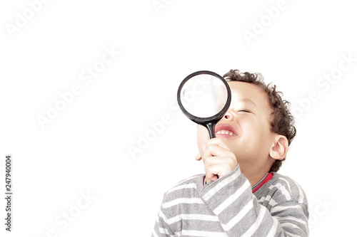 boy with magnifying glass ready to explore