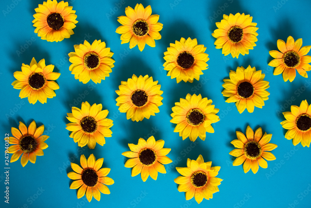 Artificial sunflowers of blue background Artificial sunflowers of blue background