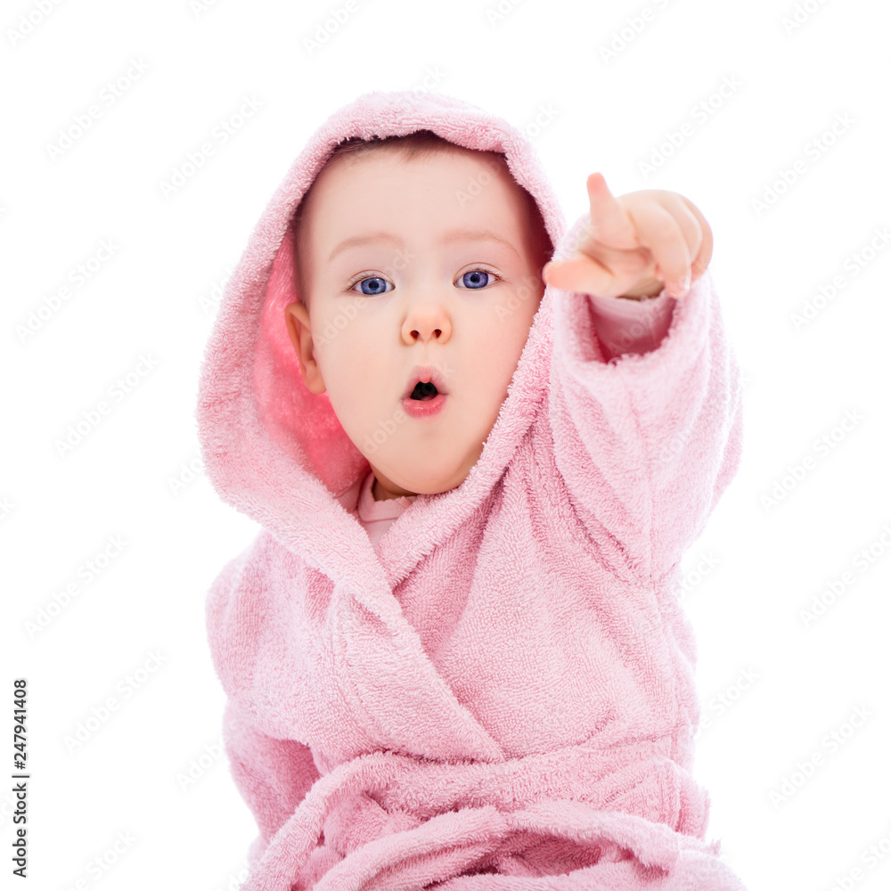 cute baby girl in pink bathrobe pointing at something isolated on white cute baby girl in pink bathrobe pointing at something isolated on white