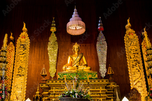 Buddha Sculpture on the Exquisite Altar at Wat Phra Kaeo - Chiang Rai, Thailand photo