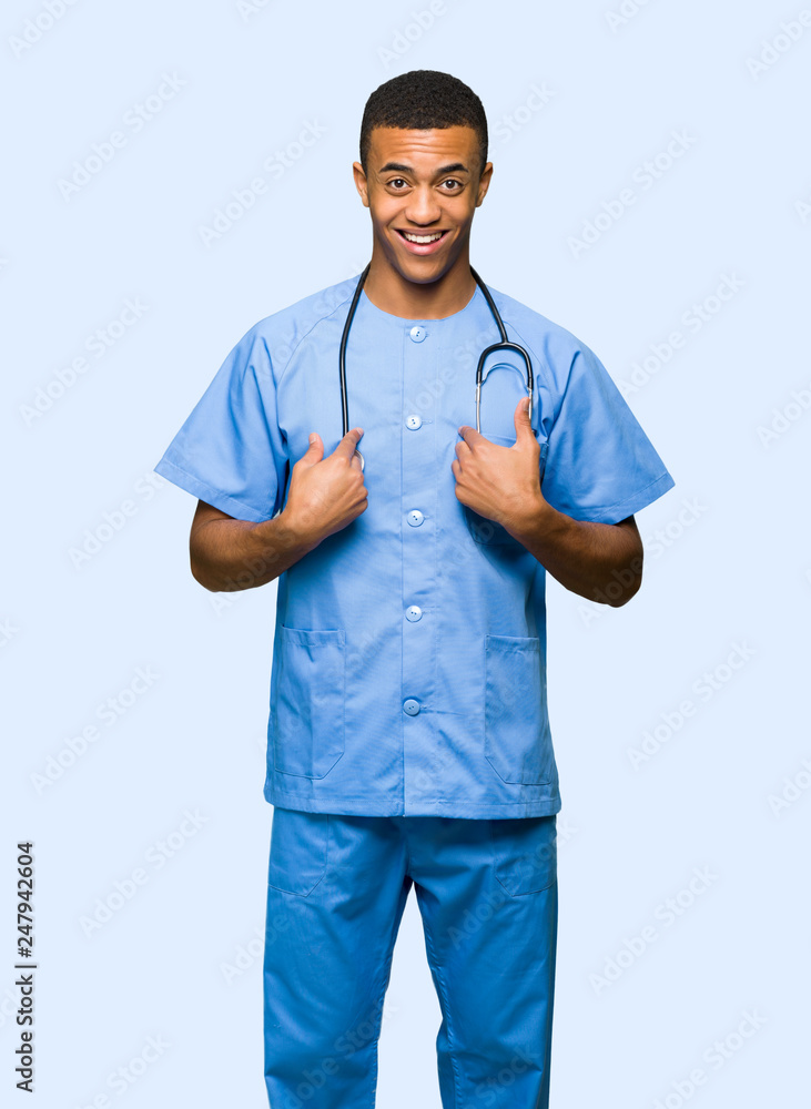 Surgeon doctor man with surprise facial expression on isolated background Surgeon doctor man with surprise facial expression on isolated background