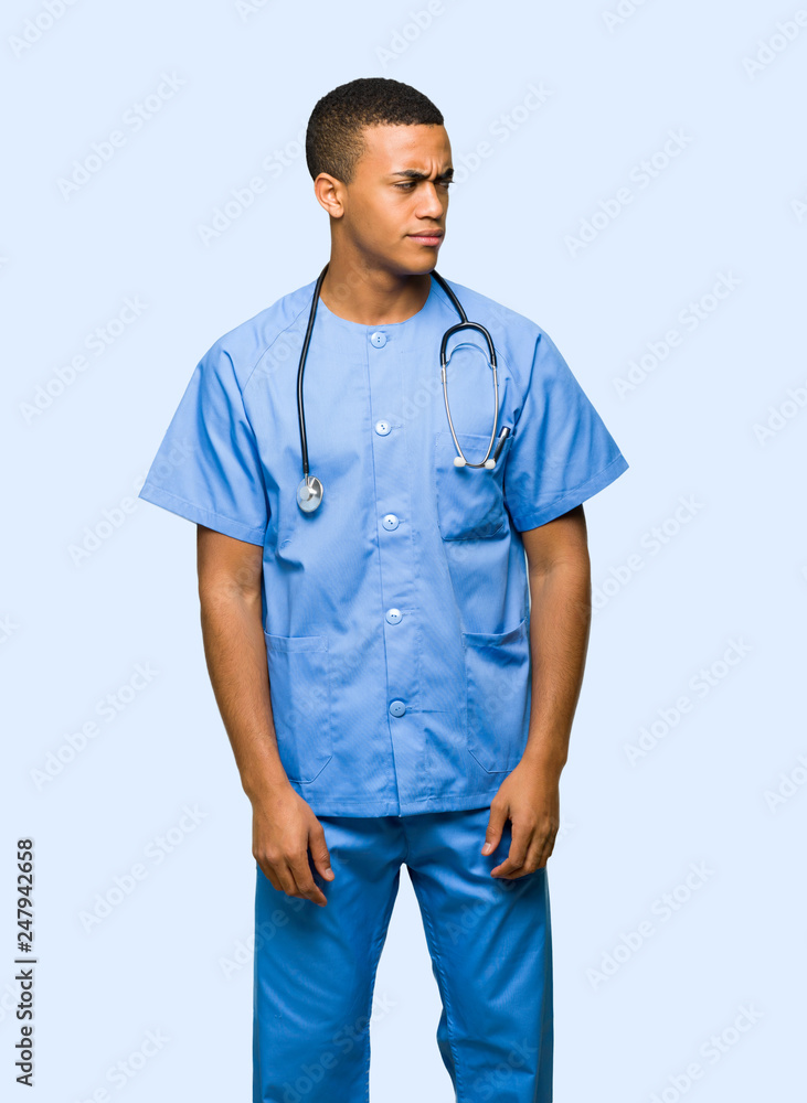 Surgeon doctor man feeling upset on isolated background Surgeon doctor man feeling upset on isolated background