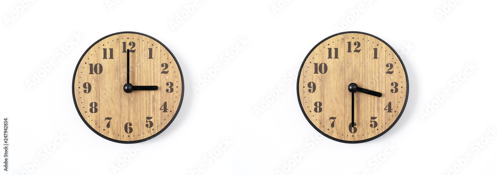 wood office wall clock with white dial on white background. wall clock on white background, top view. wood office wall clock with white dial on white background. wall clock on white background, top view.