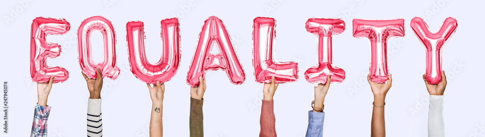 Hands holding equality word in balloon letters Hands holding equality word in balloon letters