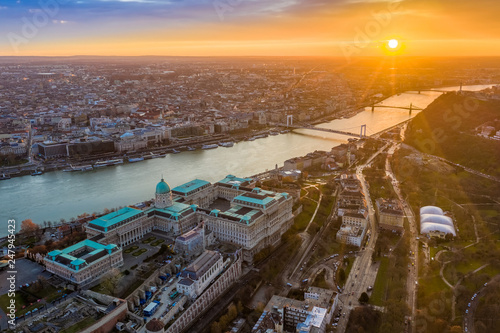 Budapest, Hungary - Aerial view of Buda Castle Royal palace at sunrise with Liberty Bridge, Elisabeth Bridge and Statue of Liberty