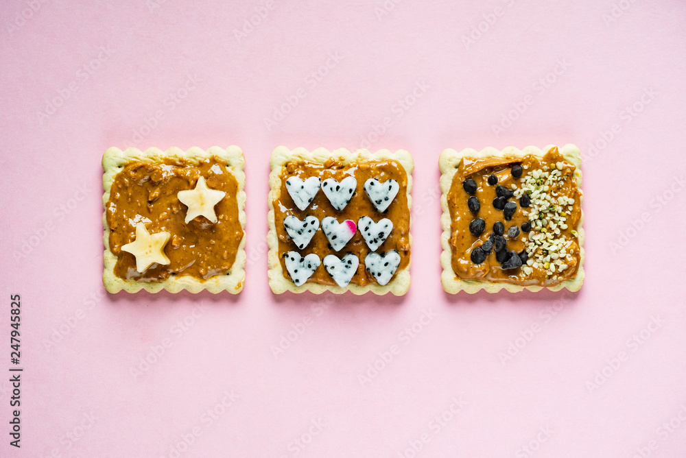 Delicious Toast with peanut butter on the pink background Delicious Toast with peanut butter on the pink background