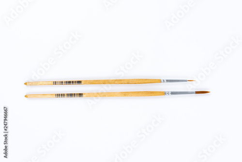 Painting brushes. Drawing tools, paint brushes on white background, copy space, top view
