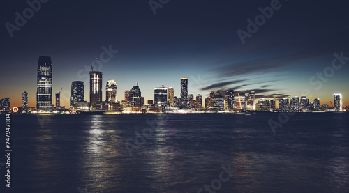 Jersey City skyline at night  color toning applied  USA.
