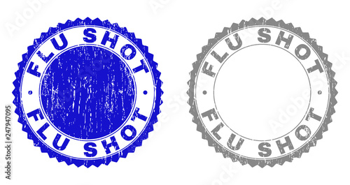 Grunge FLU SHOT stamp seals isolated on a white background. Rosette seals with distress texture in blue and grey colors. Vector rubber stamp imitation of FLU SHOT title inside round rosette.