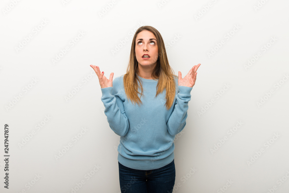 Blonde woman on isolated white background frustrated by a bad situation Blonde woman on isolated white background frustrated by a bad situation